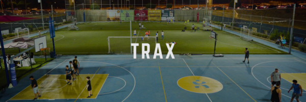 A basketball and football field for Trax and a lot of people are doing their own outdoor activity